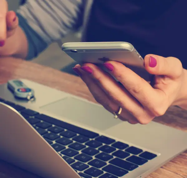 Woman holding silver iPhone 6