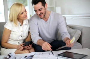 Couple looking at paint colors for new home